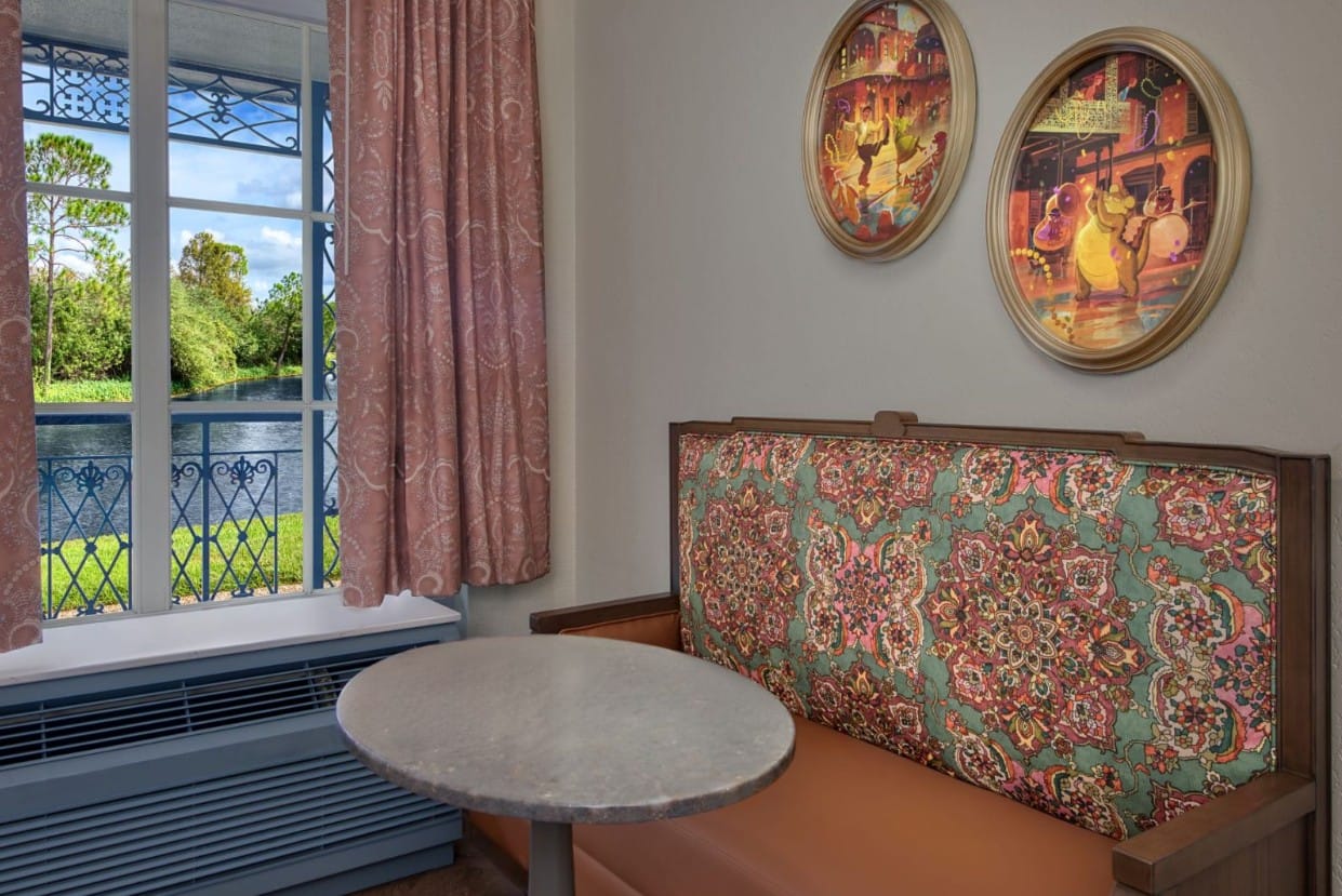 Seating area and table, plus Princess Tiana artwork