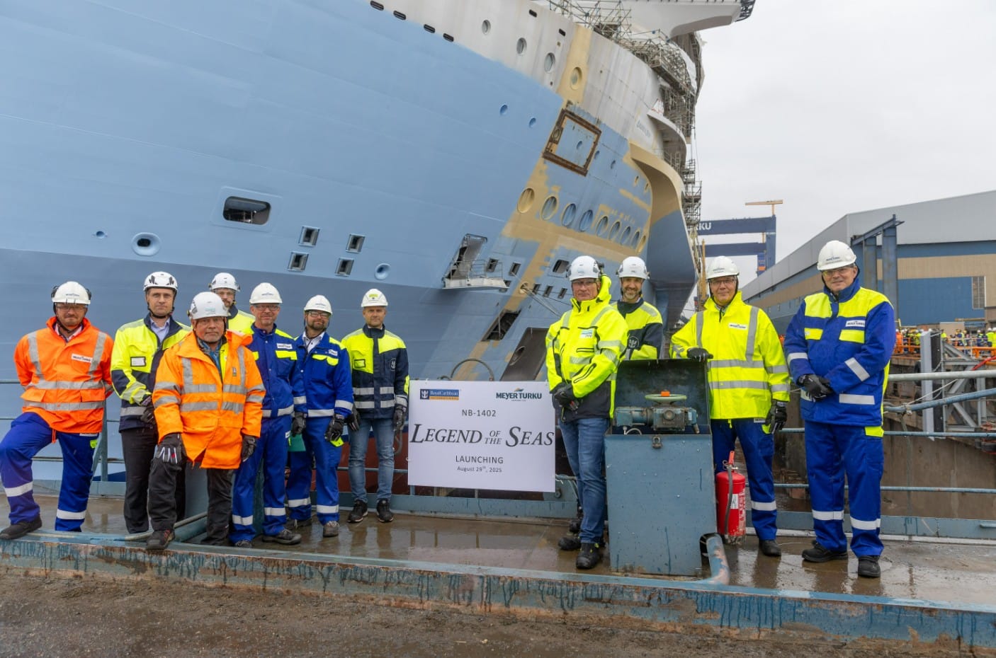 Workers at the shipyard in Turku, Finland, posing with Legend of the Seas cruise ship
