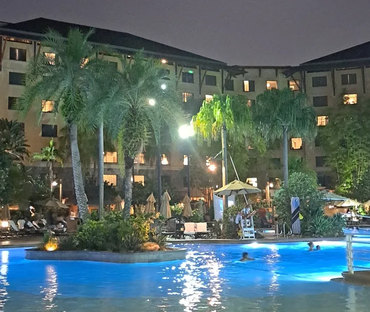 Royal Pacific pool areas and hotel buildings at night