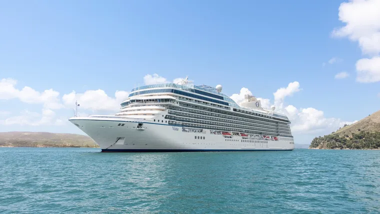 The Oceania Vista cruise ship anchored near shore
